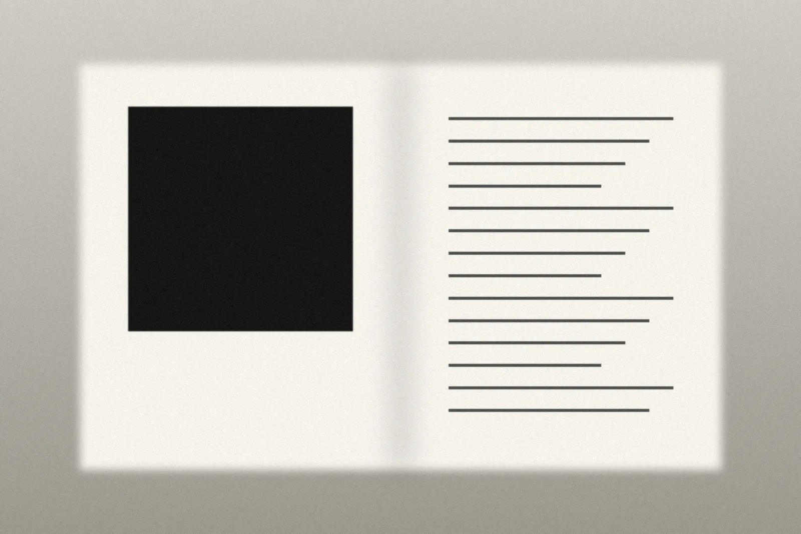 An open book spread with a black plate and text column