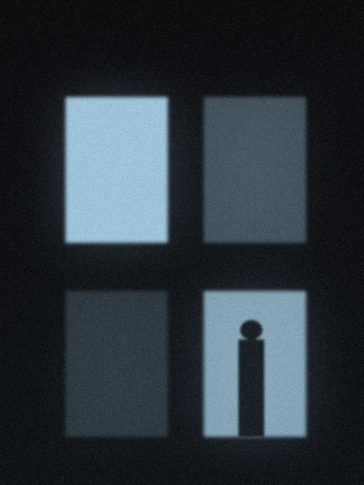 Blue-lit windows at night with a silhouetted figure
