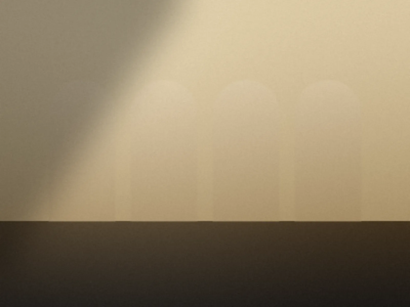 Four arches in pale golden light